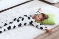 Child in cow print pajamas Royalty Free Stock Photo