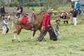 Child and a cowboy walking outdoors in Ecuador
