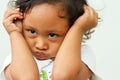 Face of a female Asian child in cranky mood Royalty Free Stock Photo