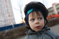 Child with crash helmet