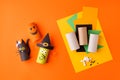 Child creates decorations for Halloween party from toilet roll. Easy eco-friendly DIY master class, craft for kids. Materials for