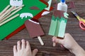 The child creates a gift of paper chocolate popsicle and mint popsicle. Made by hand.