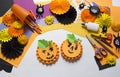 The child creates a hand-crafted pumpkin. Children`s hands.