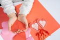 The child creates a hearts out of paper, hands close-up. Origami for Valentine& x27;s Day. Royalty Free Stock Photo