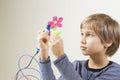 Child creating with 3D pen