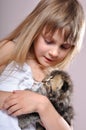 Child cuddling a kitten Royalty Free Stock Photo