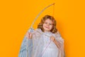 Child cupid hold bow and arrow. Valentines day. Little cupid angel child with wings. Studio portrait of angelic kid. Royalty Free Stock Photo