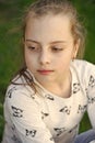 Child with cute face outdoor. Little girl with young skin on spring or summer day. Beauty kid with fresh look and long Royalty Free Stock Photo