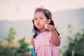 Child cute little girl blowing a soap bubbles in the park Royalty Free Stock Photo