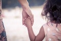 Child cute little girl and mother holding hand together Royalty Free Stock Photo