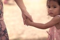 Child cute little girl and mother holding hand together Royalty Free Stock Photo