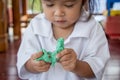 Child cute little girl playing with clay, play doh