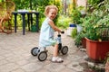 Child cute little girl riding bike outdoors Royalty Free Stock Photo