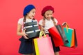 Child cute small girls on shopping tour. Best price. Buy now. Visit shopping mall. Kids girls hold bunch shopping bags Royalty Free Stock Photo