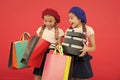 Child cute small girls on shopping tour. Best price. Buy now. Visit shopping mall. Kids girls hold bunch shopping bags Royalty Free Stock Photo