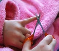 Child cuts nails