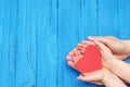 Child and dad hands holding red heart Royalty Free Stock Photo