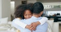 Child, dad and hug in home, back and smile with welcome, reunion and memory with love in living room. African kid Royalty Free Stock Photo