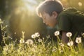 Child with dandelion flower in a spring park. Kid blowing dandelion. Wildlife Enjoyment. Boy is happy outside Royalty Free Stock Photo