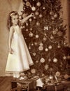 Child decorate on Christmas tree