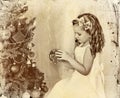 Child decorate Christmas tree . Old photo on yellow paper. Royalty Free Stock Photo