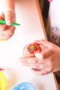 Child decorate Easter eggs