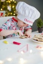 Child decorates Christmas cookies Royalty Free Stock Photo