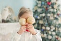 Child decorating Christmas tree at home. Boy hangs Christmas balls on tree. Christmas Eve concept Royalty Free Stock Photo