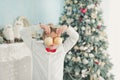 Child decorating Christmas tree at home. Boy hangs Christmas balls on tree. Christmas Eve concept Royalty Free Stock Photo