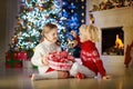 Kids decorate Christmas tree. Child on Xmas eve.