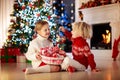 Kids decorate Christmas tree. Child on Xmas eve Royalty Free Stock Photo