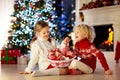 Kids decorate Christmas tree. Child on Xmas eve Royalty Free Stock Photo