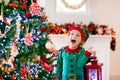 Child decorating Christmas tree. Kid on Xmas eve Royalty Free Stock Photo