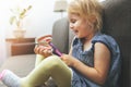 Child dental health - little girl training on model how to brush teeth correctly Royalty Free Stock Photo