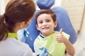 A child with a dentist in a dental office.