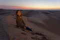 Child in desert at sunset Royalty Free Stock Photo
