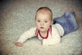 Child development concept. Baby with blue eyes on adorable face Royalty Free Stock Photo