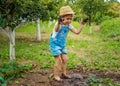 a child in the dirt in the garden holds the soil in his hands. Selective focus. Royalty Free Stock Photo