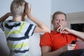 Child is disturbing his father Royalty Free Stock Photo