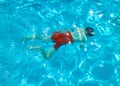 Child dives in the pool