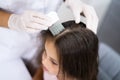 Child Doctor Checking Head Hair Royalty Free Stock Photo