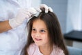 Child Doctor Checking Head Hair Royalty Free Stock Photo