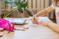 The child does his homework, drawing with a ruler. Selective focus. Royalty Free Stock Photo