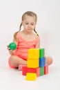 The child does not know where to put ball in house Royalty Free Stock Photo