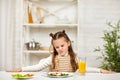 the child does not want to have breakfast. Royalty Free Stock Photo