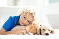 Child, dog and cat. Kids play with puppy, kitten Royalty Free Stock Photo
