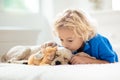 Child, dog and cat. Kids play with puppy, kitten Royalty Free Stock Photo