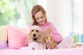 Child, dog and cat. Kids play with puppy, kitten Royalty Free Stock Photo