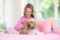 Child, dog and cat. Kids play with puppy, kitten Royalty Free Stock Photo