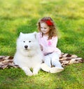 Child and dog resting on the grass Royalty Free Stock Photo